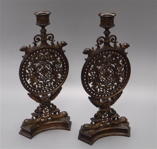 A pair of decorative pierced metal candlesticks 32cm
